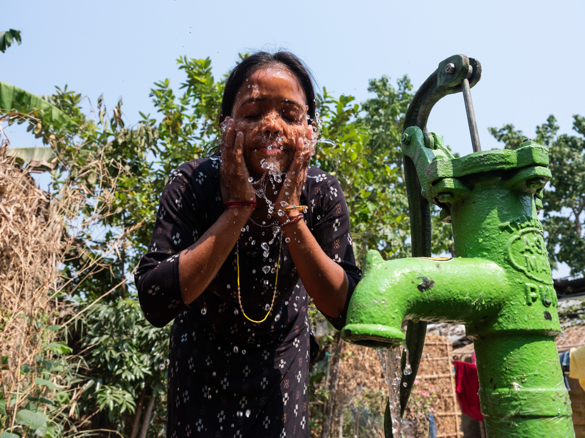 Girl washing her face