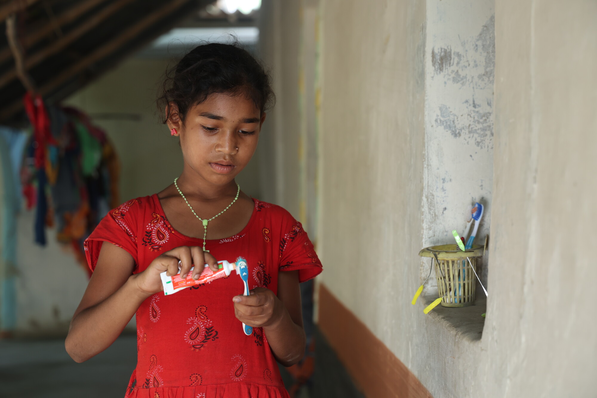 Girl using toothpaste