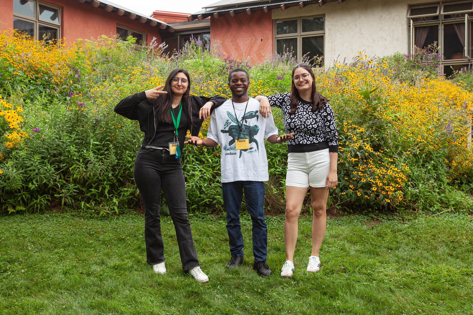 Three young adults pose for a picture. 