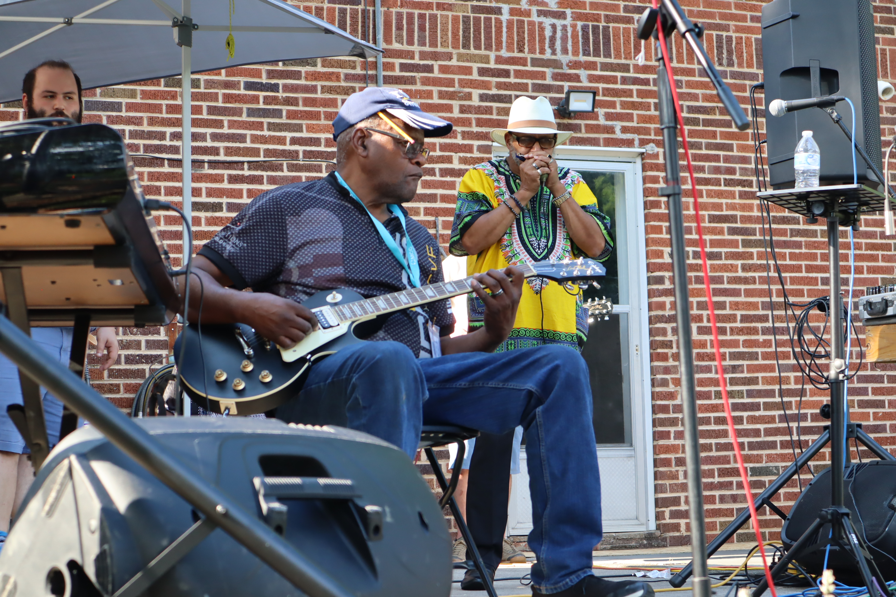 man plays guitar on stage