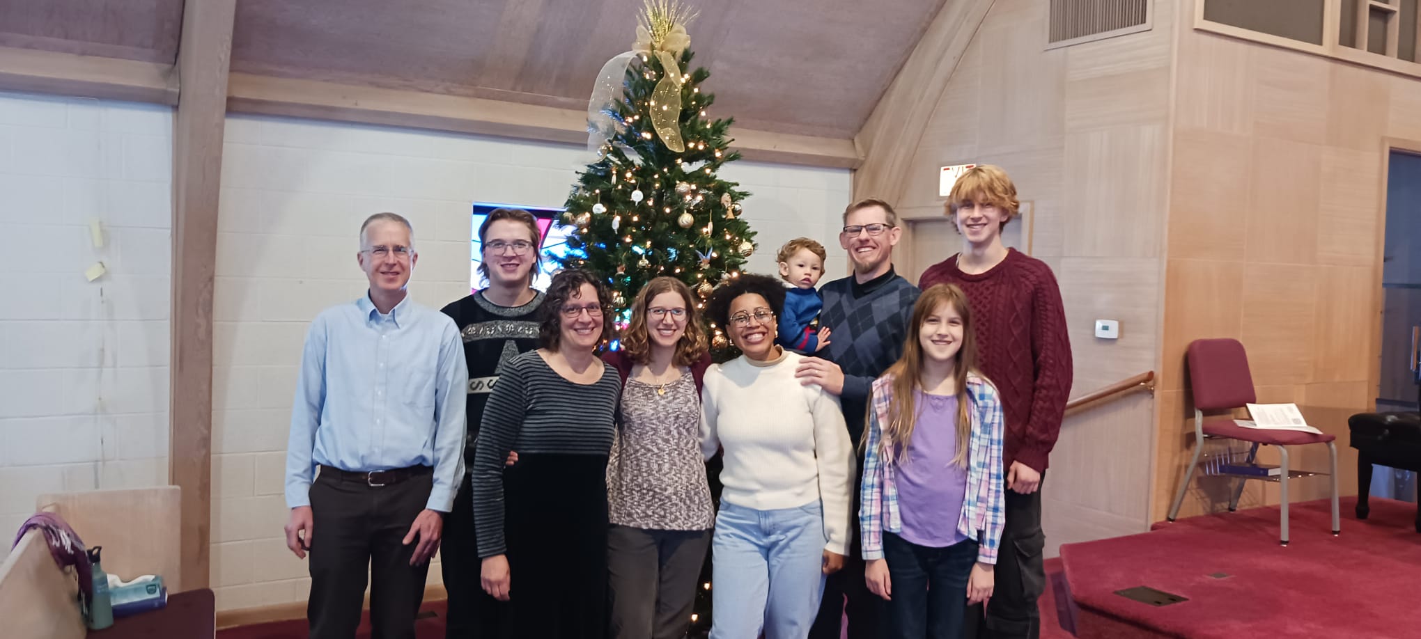 Family picture in front of Christmas tree