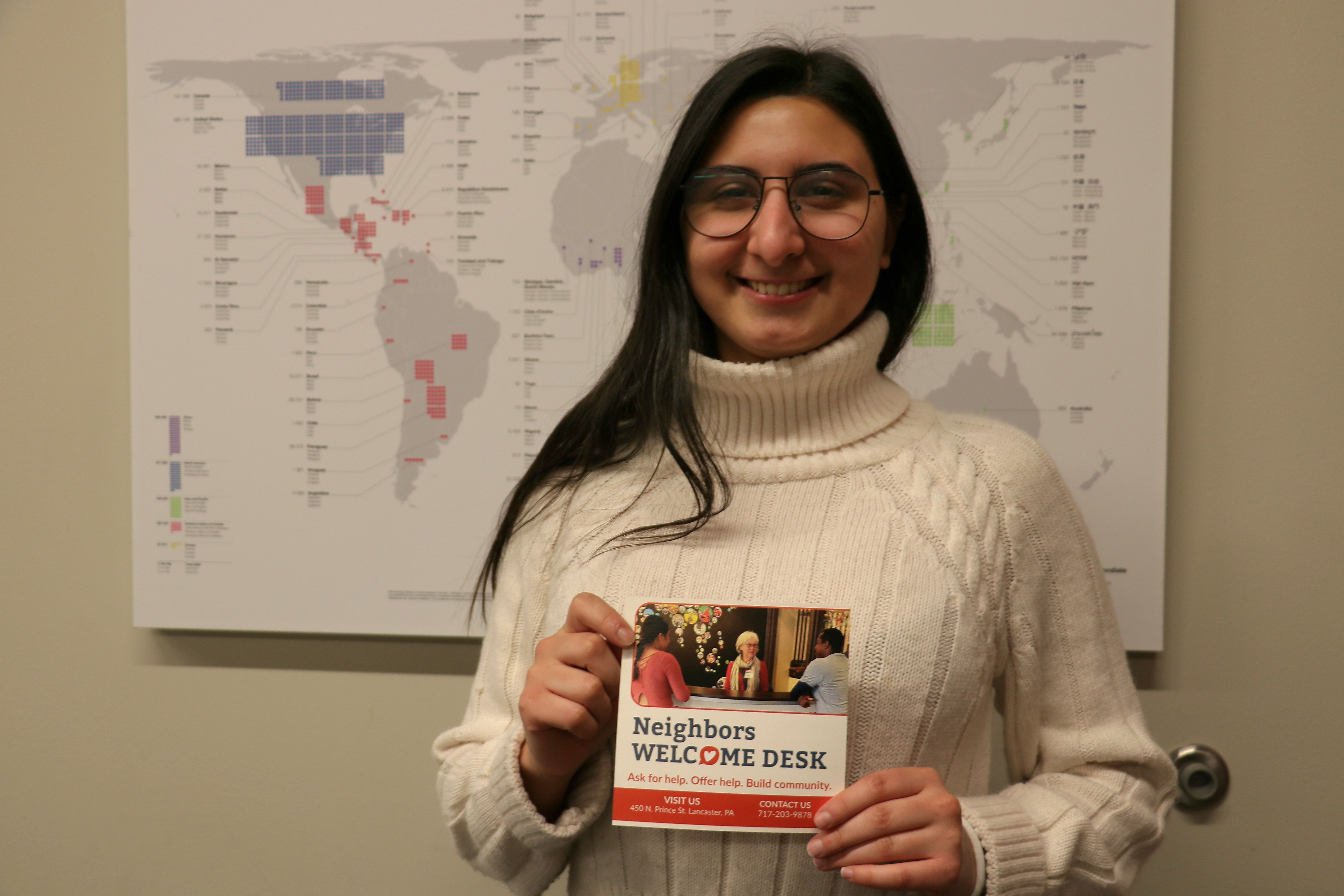 Young adult lady holding a flyer