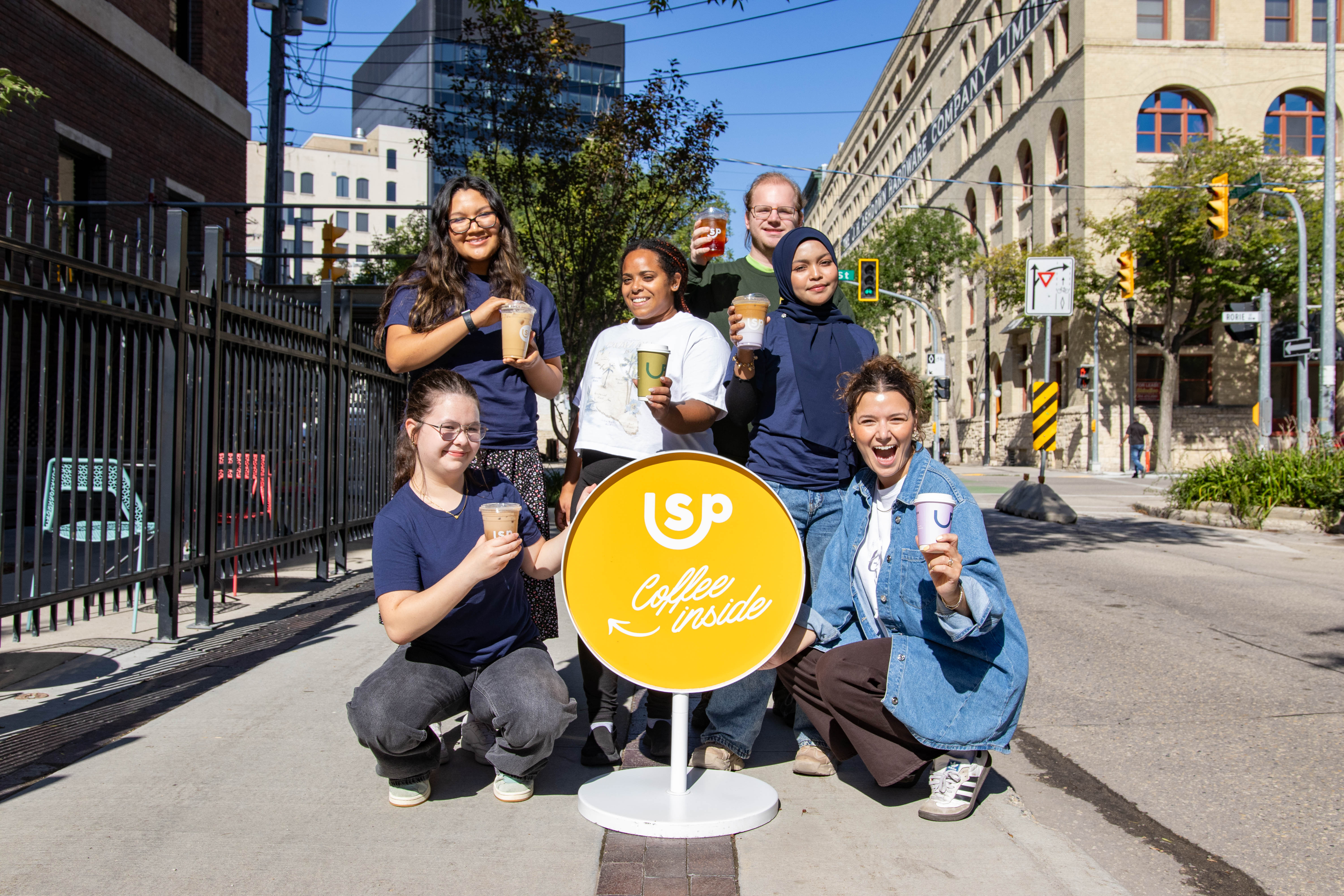 Sam's PLace Youth Program participants outside of the Sam's Place building in summer