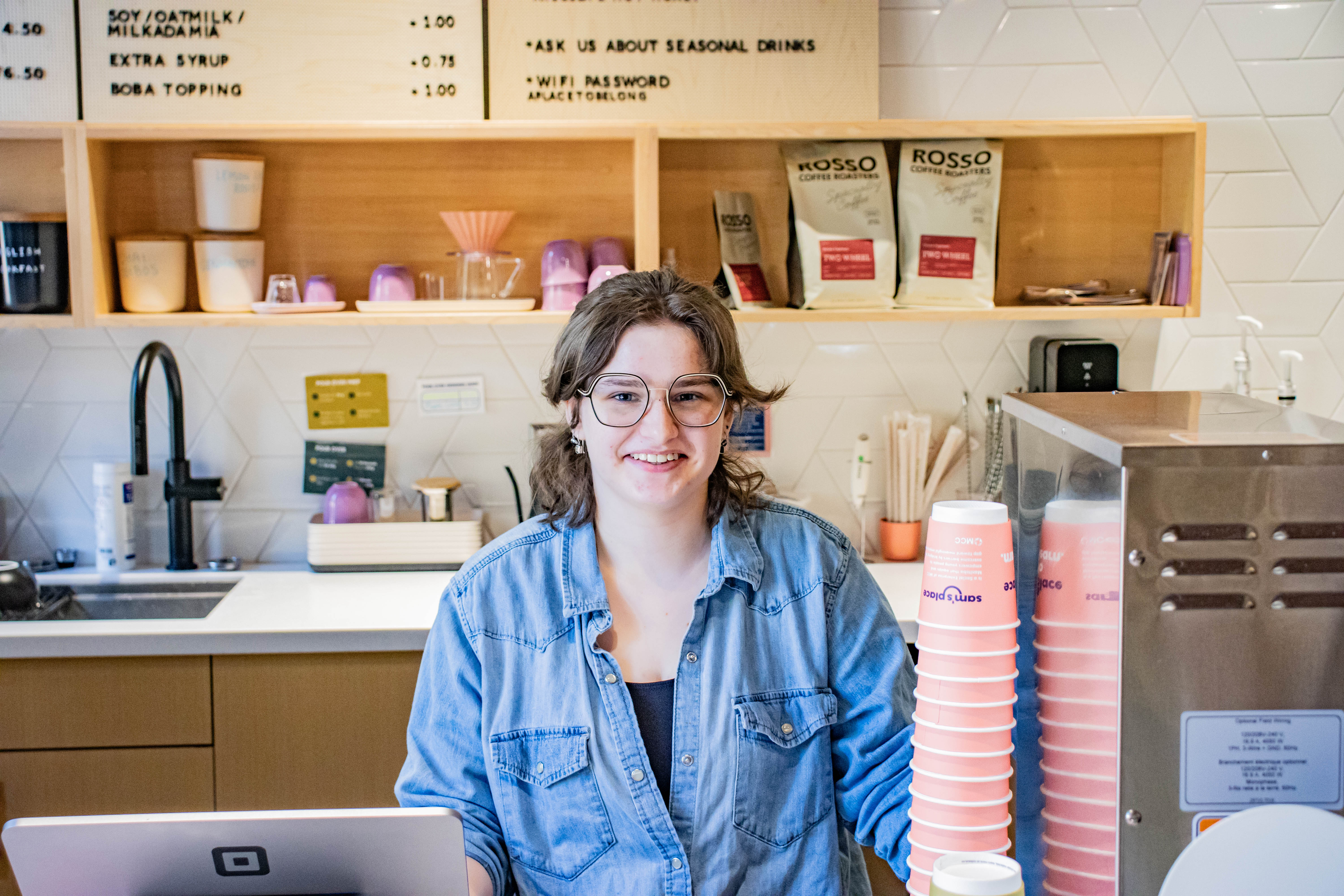 Sam's Place barista Wren Hildebrandt behind the counter