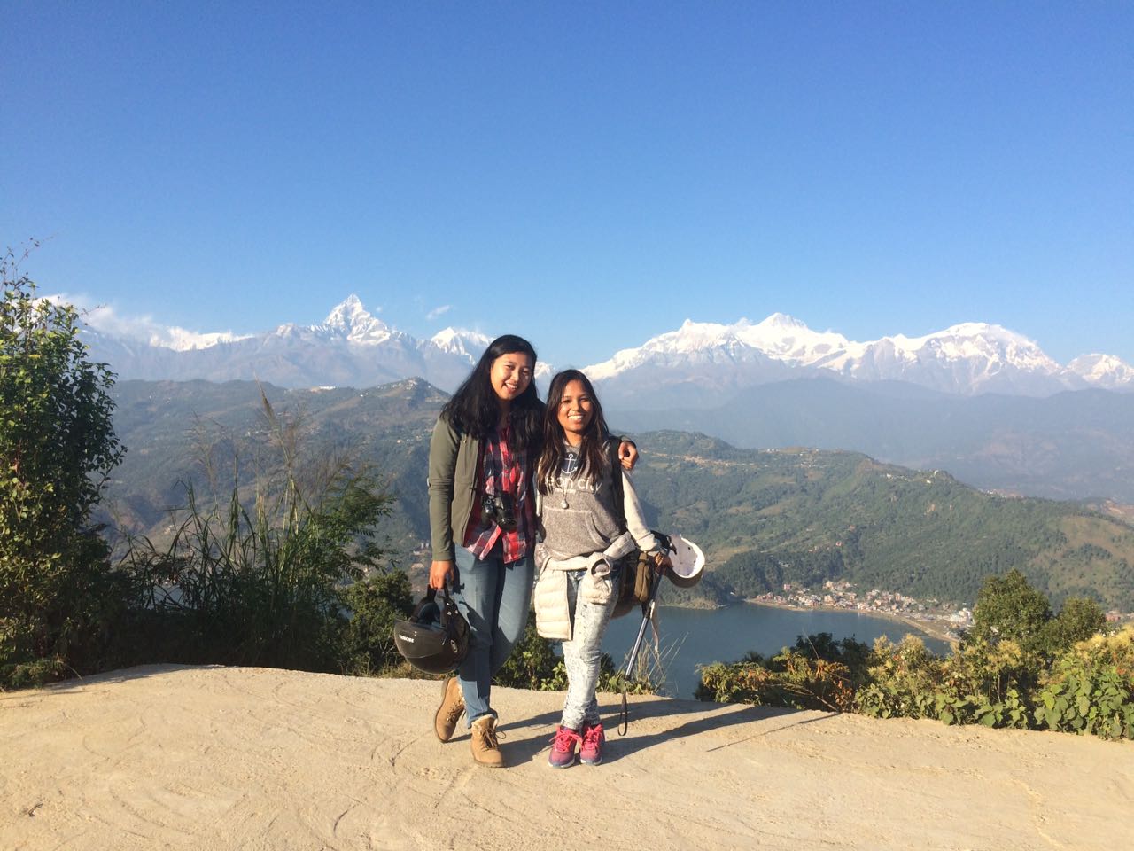 Two women standing on a path