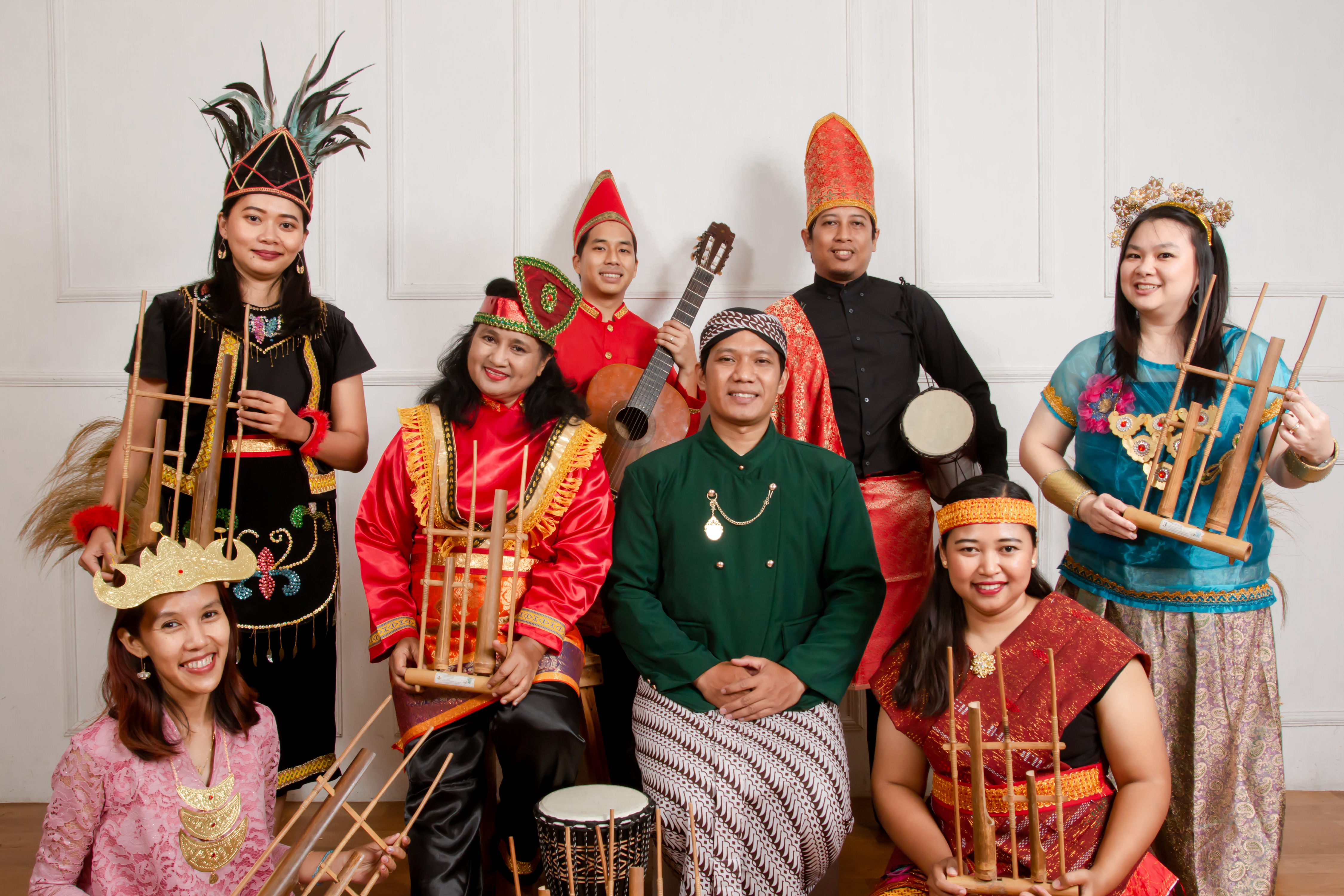 Musical group holding their instruments