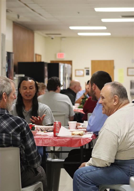 people talking around tables