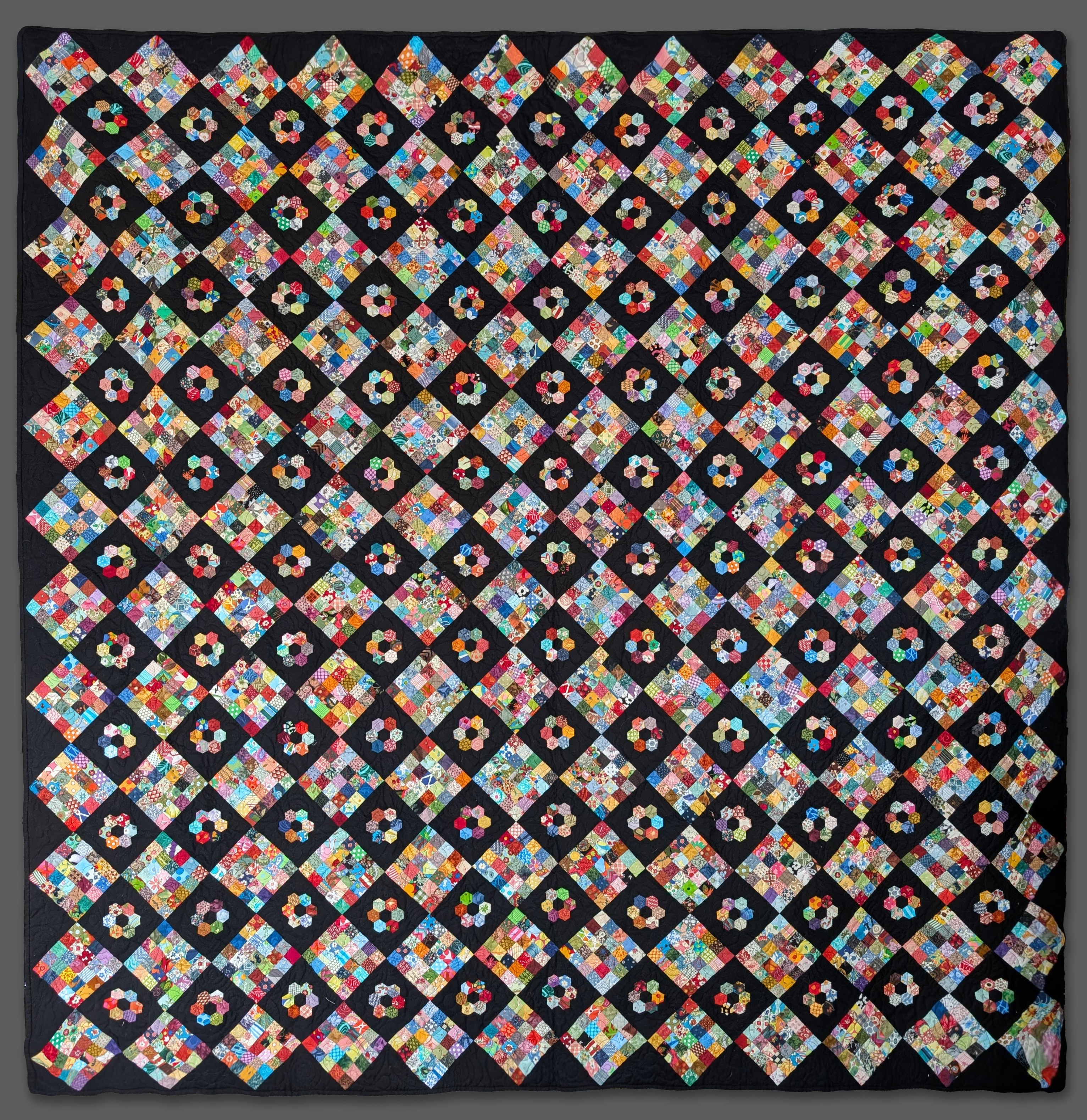 A postage-stamp quilt of many colours