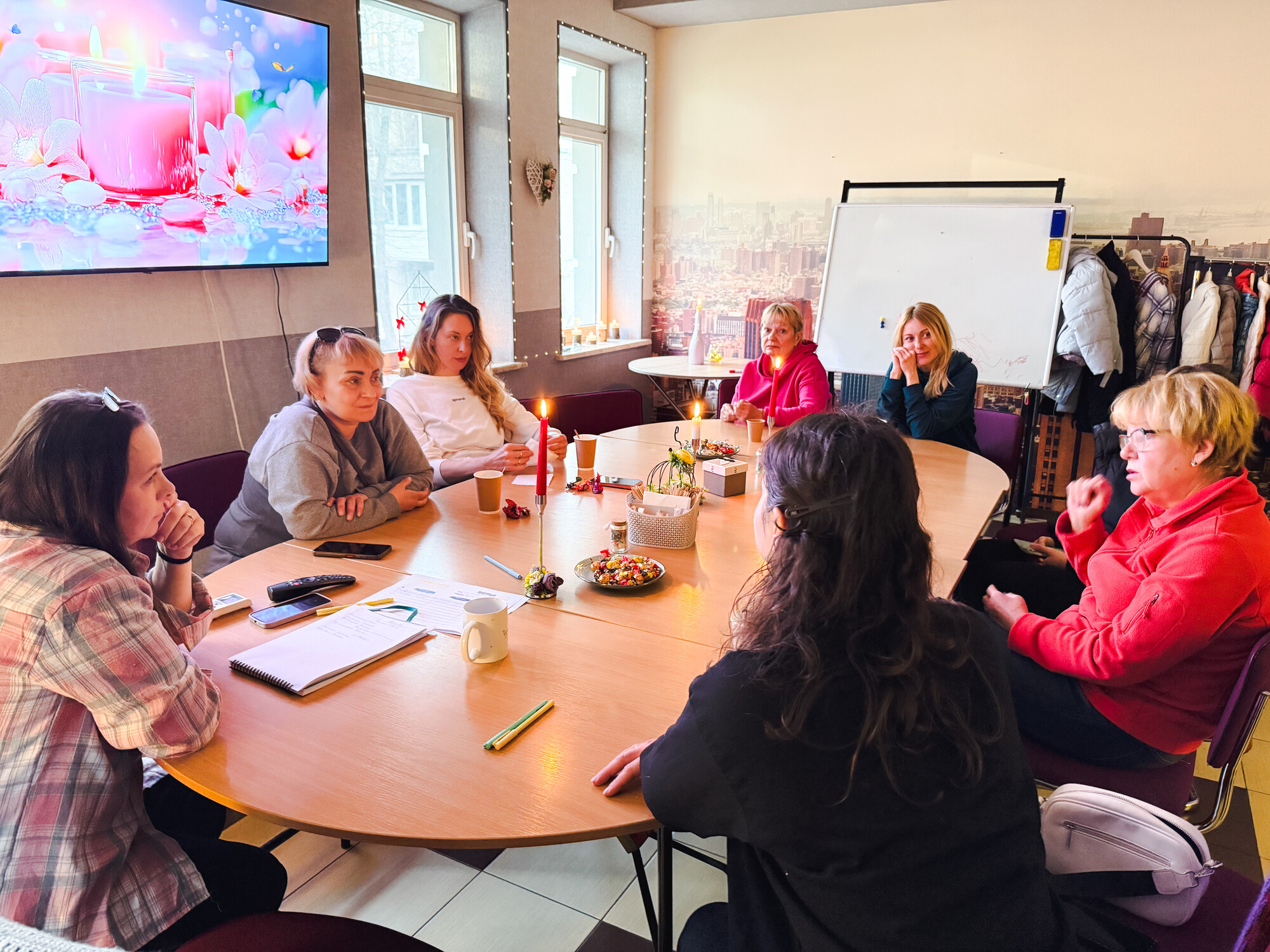 group of women sitting around oblong board table