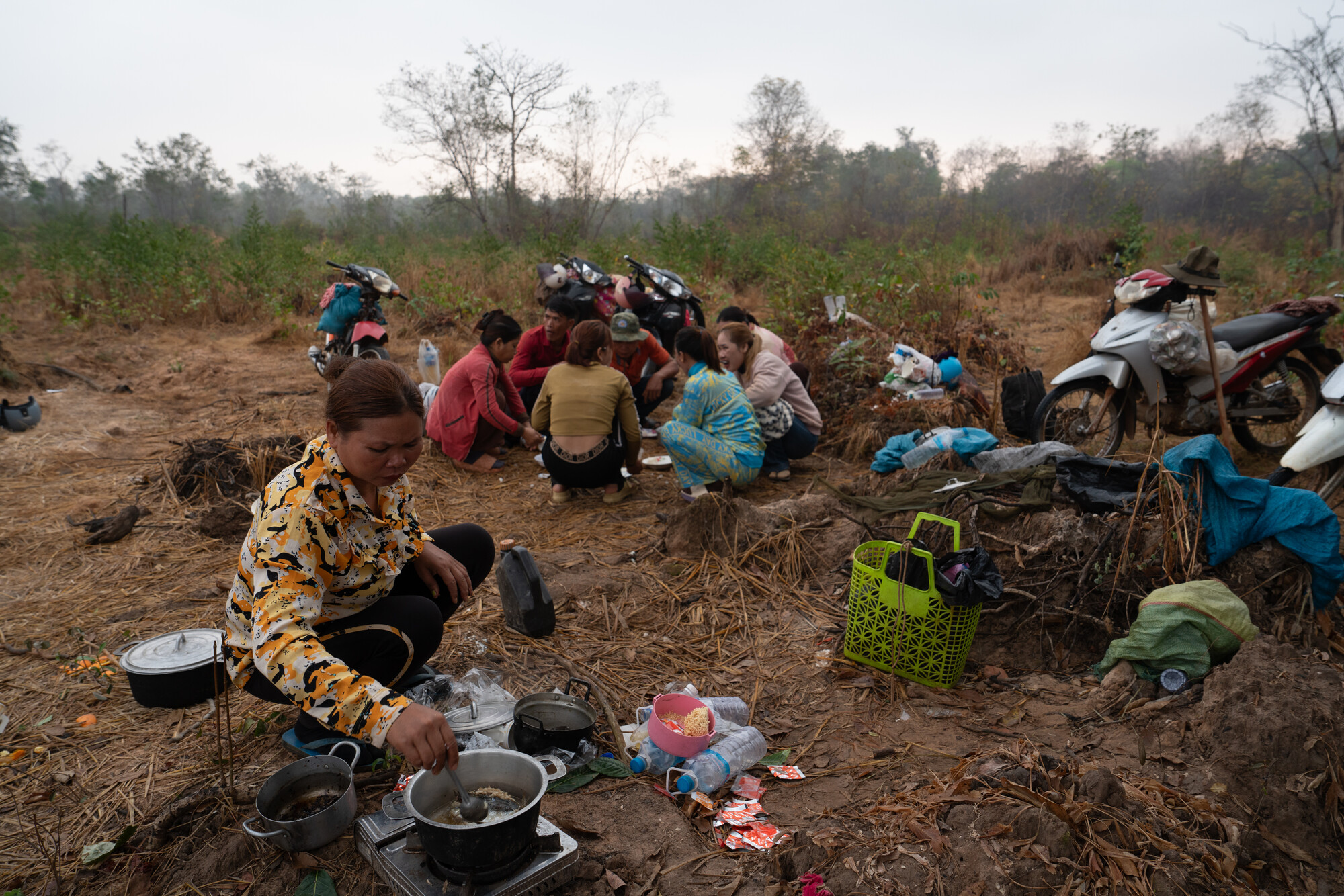 Forest patrol members have a breakfast of fish caught in a nearby channel before departing to the village of Vattanak.