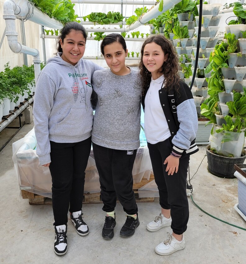 From left, Jenan Ajarma, Elena Bilal and Sara Ghabbash all participate in the Dabka dance program at the Lajee Center at the Aida Refugee Camp in Bethlehem, West Bank. They are pictured here in front