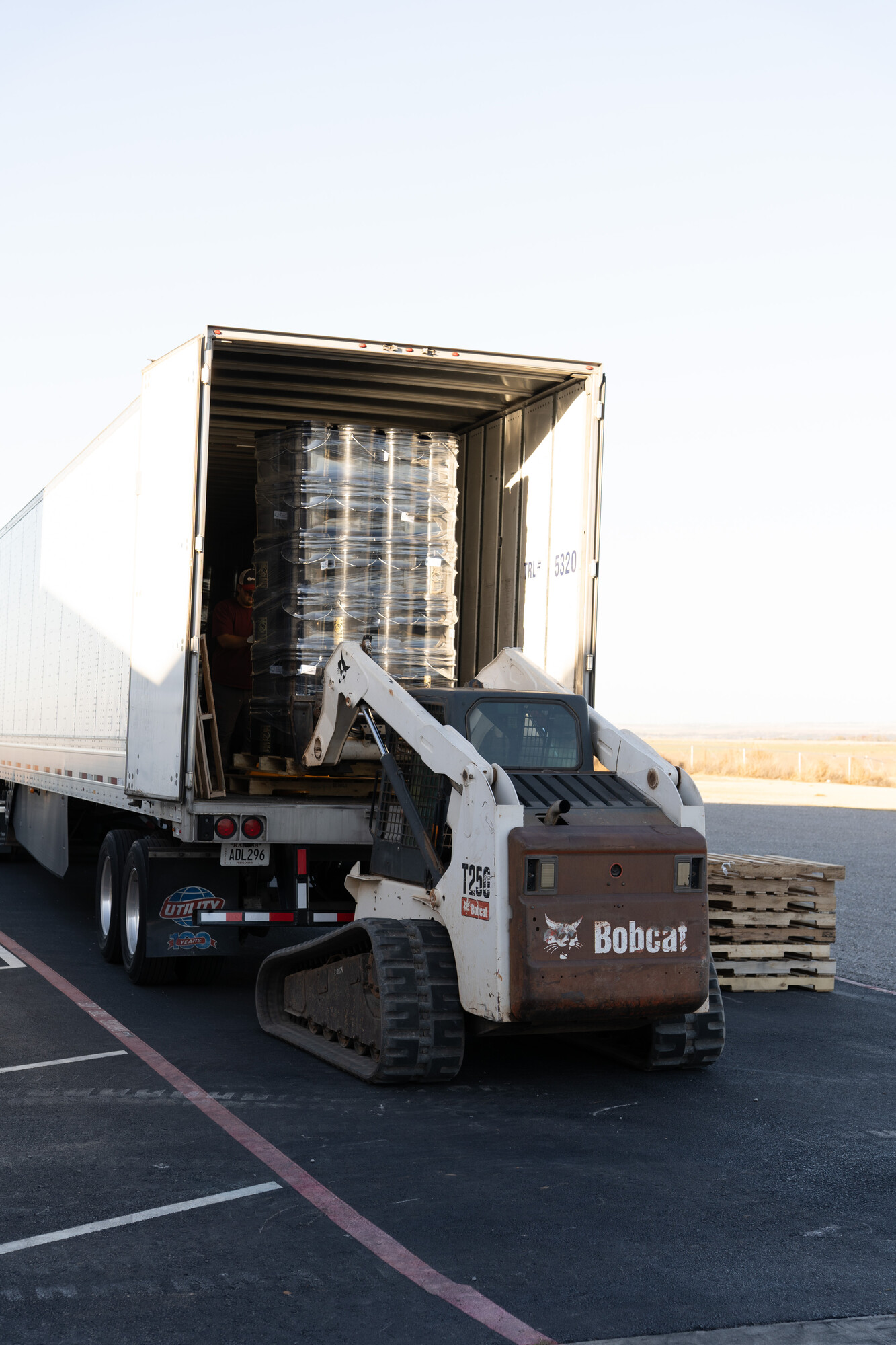 A shipping pallet of relief kits is lifted onto the MCC Central States truck during Pleasant View Mennonite Church's fourth annual relief kit packing event.