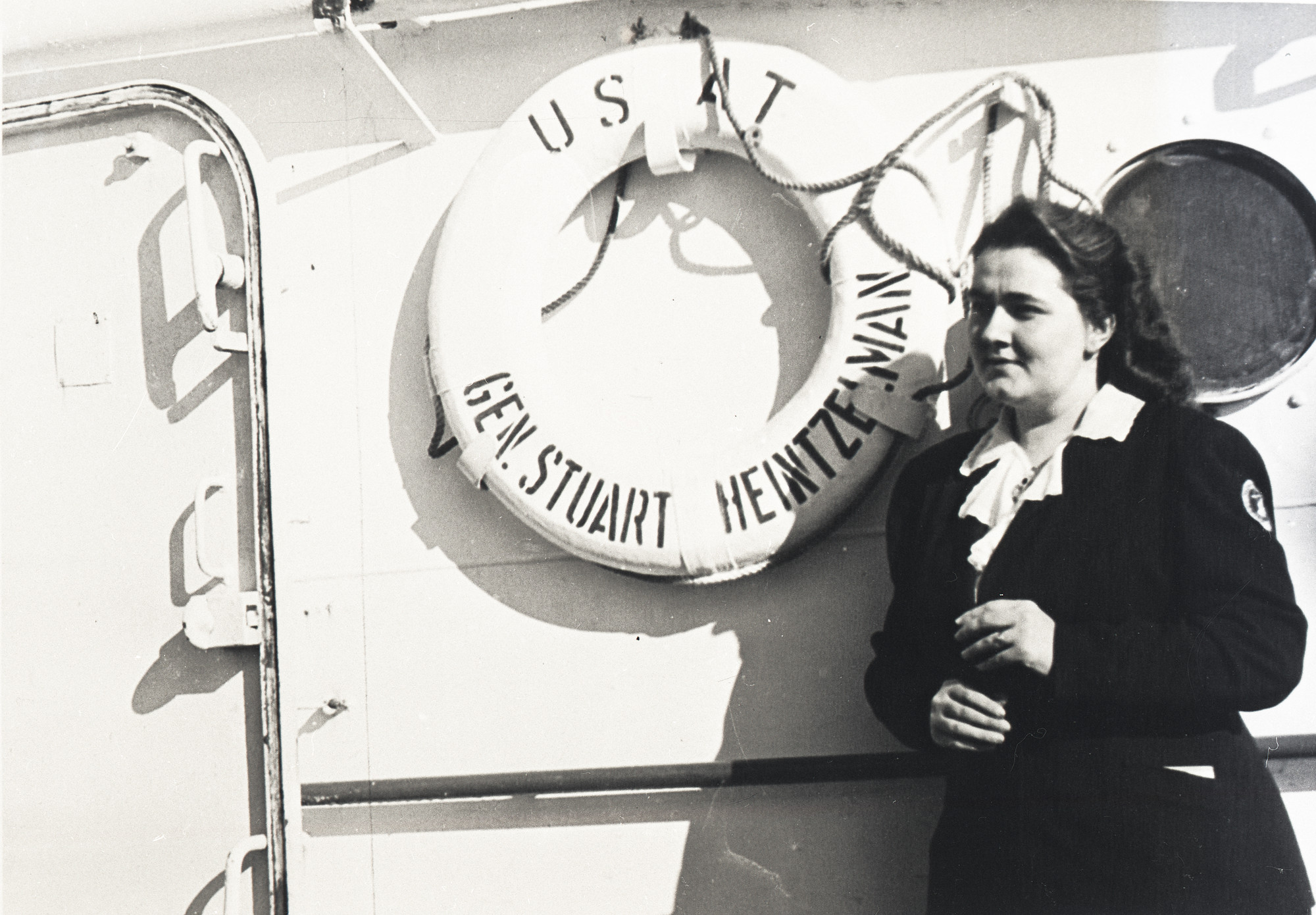 In Bremerhaven, Germany, 1948, MCC representative Elfrieda Dyck was photographed just before the "General Stuart Heintzelman" lifted anchor, carrying refugees to Paraguay.

Eight hundred sixty Menno