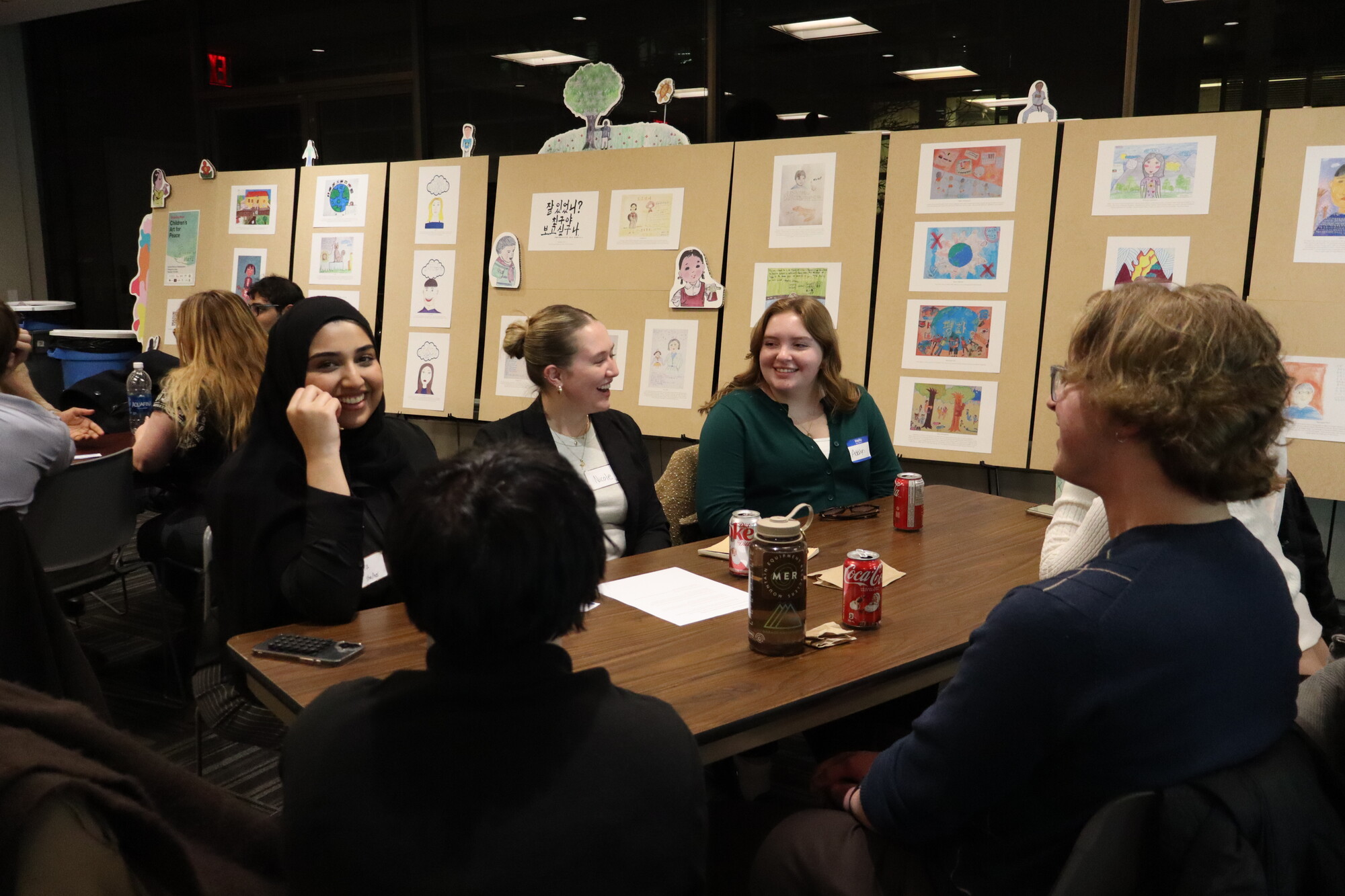 Students engage in small group discussions during the first night of the seminar.