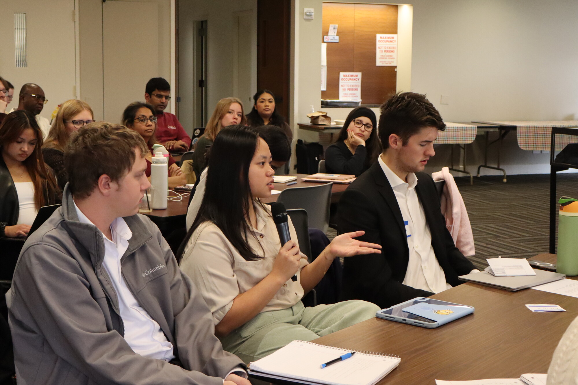 Celline asks a question during a session.