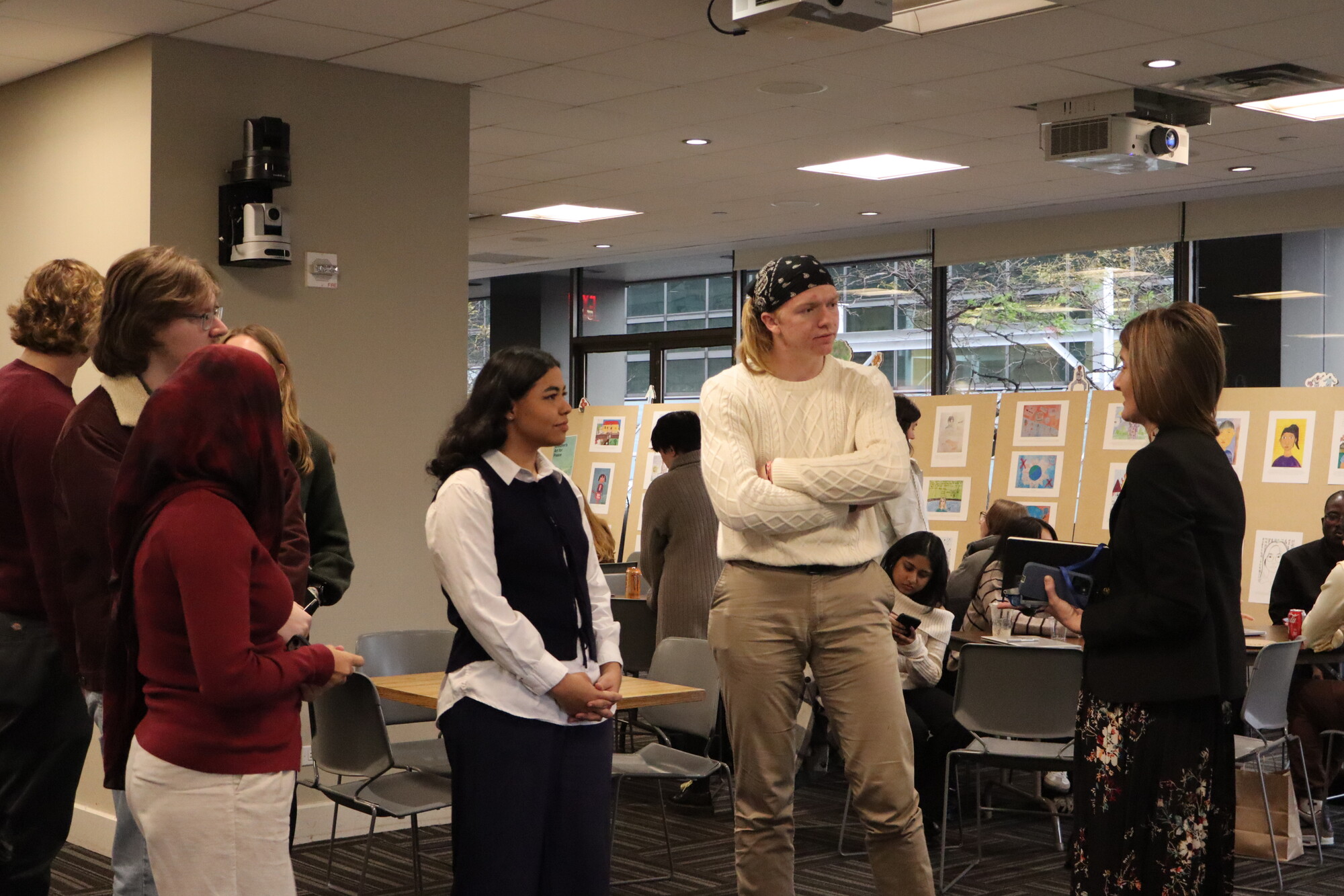 Students engage with a Foreign Service Officer and Economic Advisor at the U.S. Mission to the UN (right; name withheld for security reasons) following her session. Logan Daughterty and Livia Dias Mor