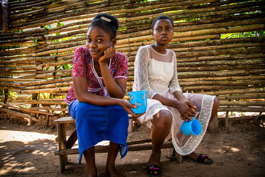Leonie Ngweja Kingenzi, 18 years old, graduated with a teaching degree, sits with Channele Kingenzi, her younger sister. 