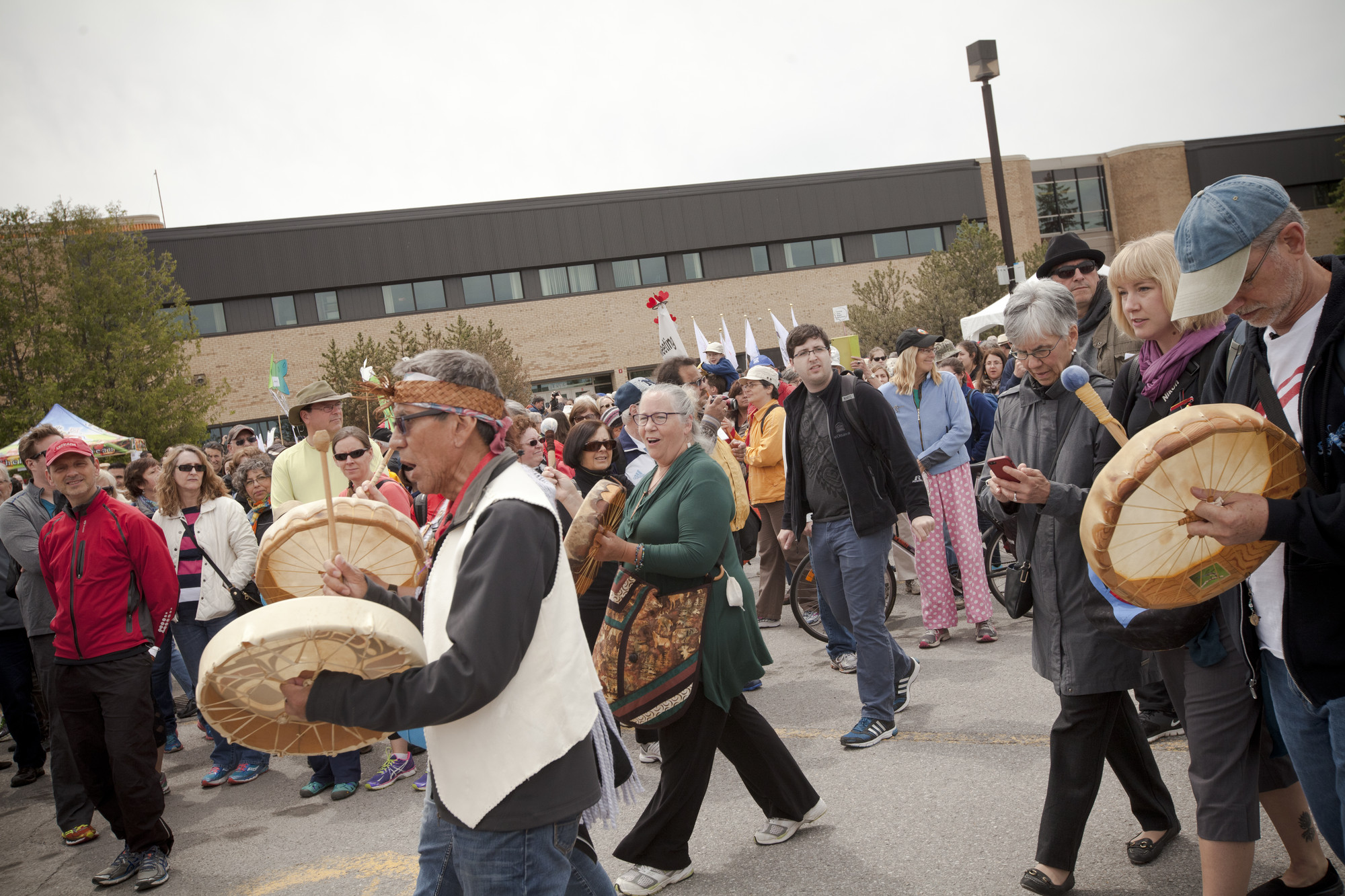 An Indigenous drum group lead walkers out of the Ecole Secondaire de l'Ile in Gatineau, Quebec. More than 7000 people gathered to walk for reconciliation. The walk began at Ecole Secondaire de l'Ile