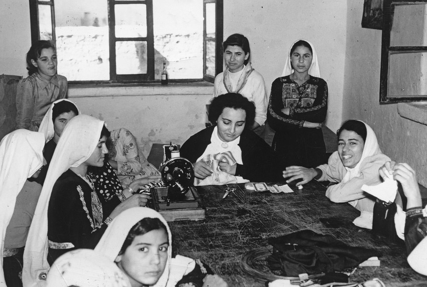 MCC worker Sophie Farran (center) worked with women and girls in the MCC-supported sewing and needlework project at the Ein es-Sultan refugee camp bordering Jericho, West Bank, in 1961.
 
In 1952, R
