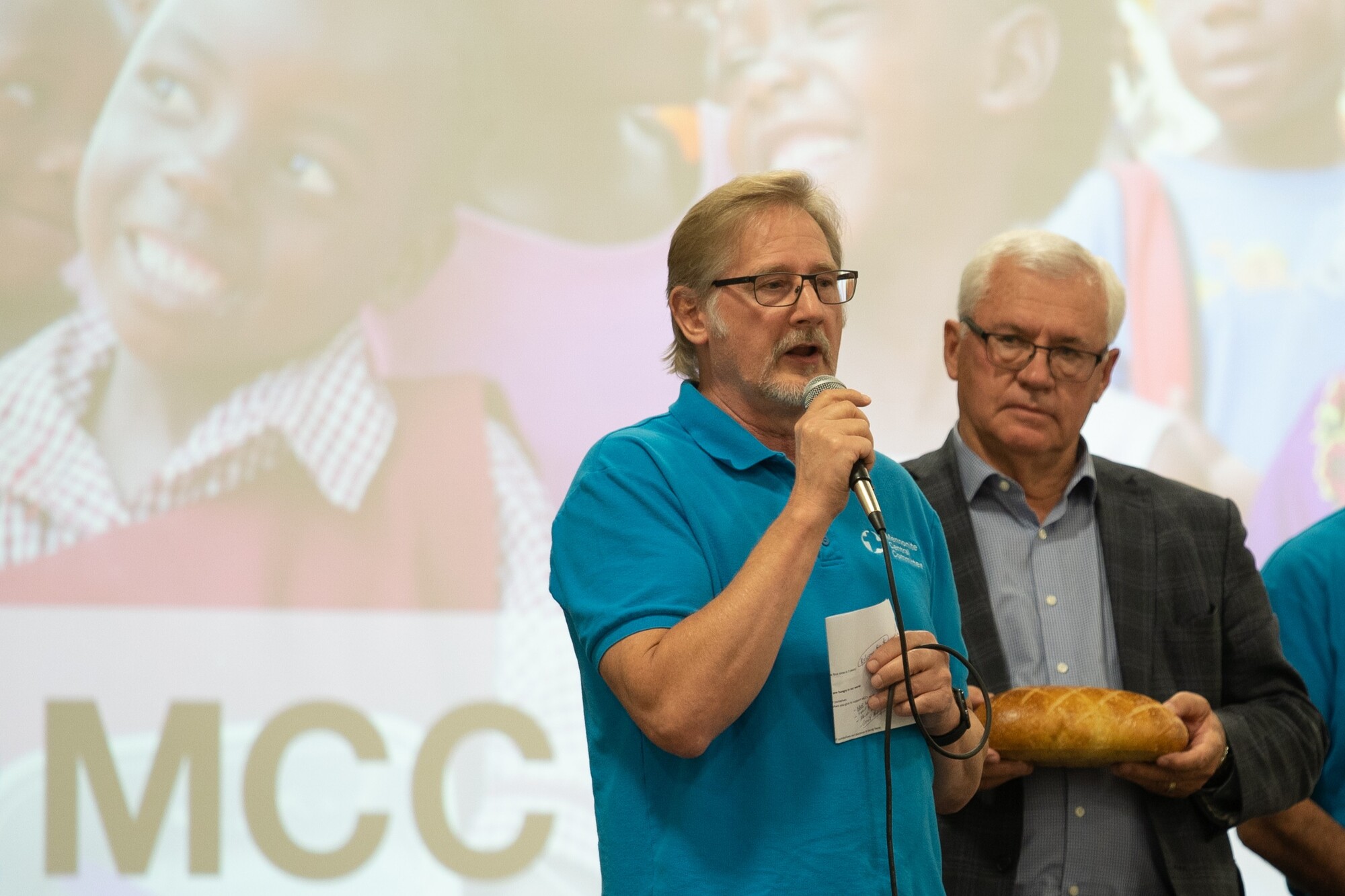 Wayne Bremner, Executive Director for MCC BC, and former Abbotsford mayor Henry Braun, at the 53rd annual MCC Festival for World Relief on September 16, 2022. Henry holds a loaf of bread to symbolize