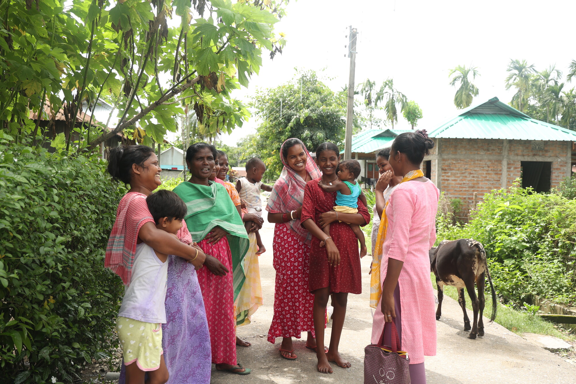MCC partner Little Flock Fellowship staff member, Jasinta Bhengra, extreme right, greets an informal group to discuss water, sanitation, and hygiene (WASH) issues.