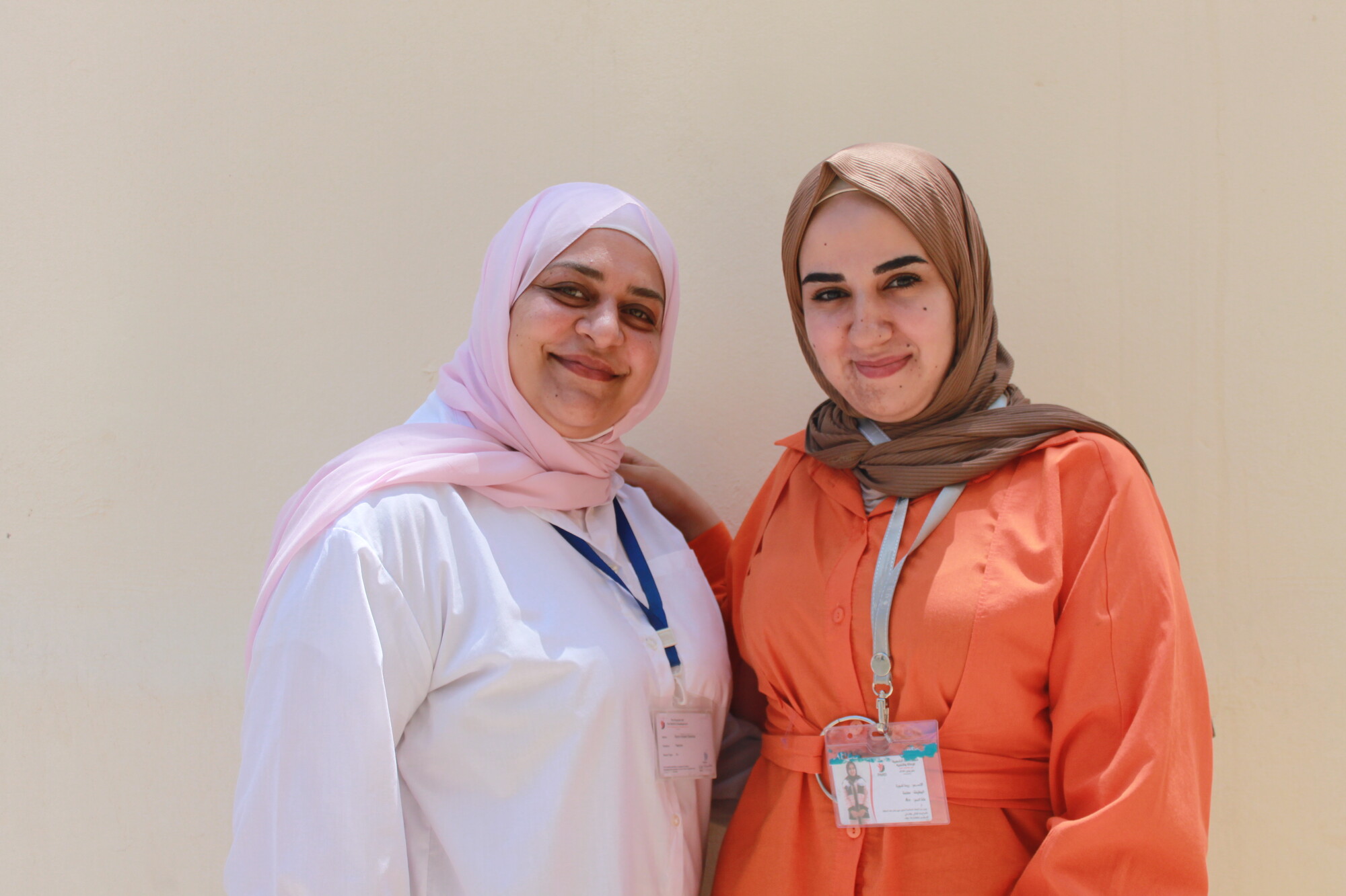 Two teachers* with MCC partner Popular Aid for Relief and Development (PARD) stand in front of their school in Wadi Zainy, Lebanon.

*Names withheld for security purposes.