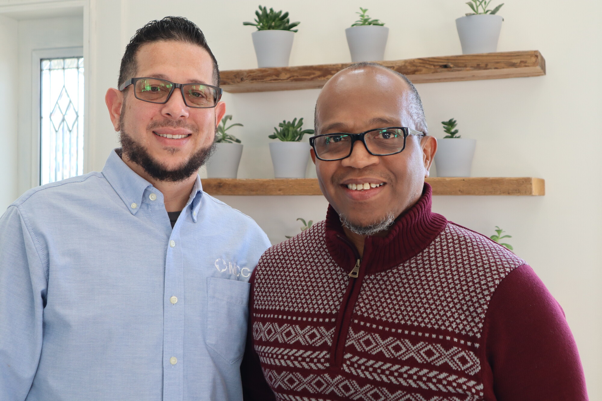 Through the MCC East Coast Open Arms Network, a refugee support program, Rolando Flores-Rentas (left) partners with Pastor Reginaldo Hill (right), pastor of Ministerios Peniel Internacional, an LMC co