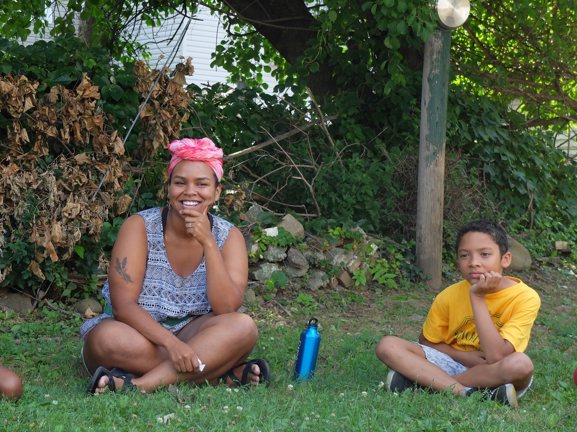Victoria Gillon (left), a 2019 Summer Service Program participant serving in Brooklyn, New York, facilitates a conversation on environmental justice with youth participants, including Elgin Storbakken