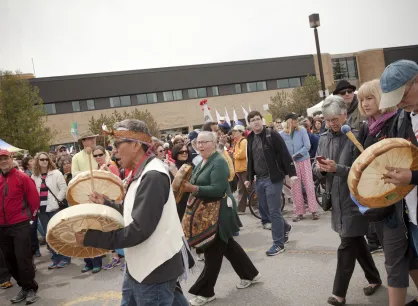 An Indigenous drum group lead walkers out of the Ecole Secondaire de l'Ile in Gatineau, Quebec. More than 7000 people gathered to walk for reconciliation.