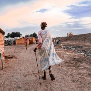 Lady walking in a small village