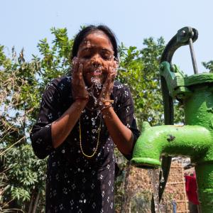 Girl washing her face