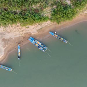 Arial view of fishing boats on a river in Cambodia