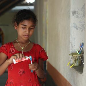 Girl using toothpaste