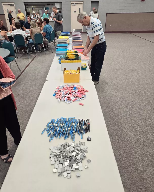 Members from a church pack school kits for MCC's School Kit Challenge.