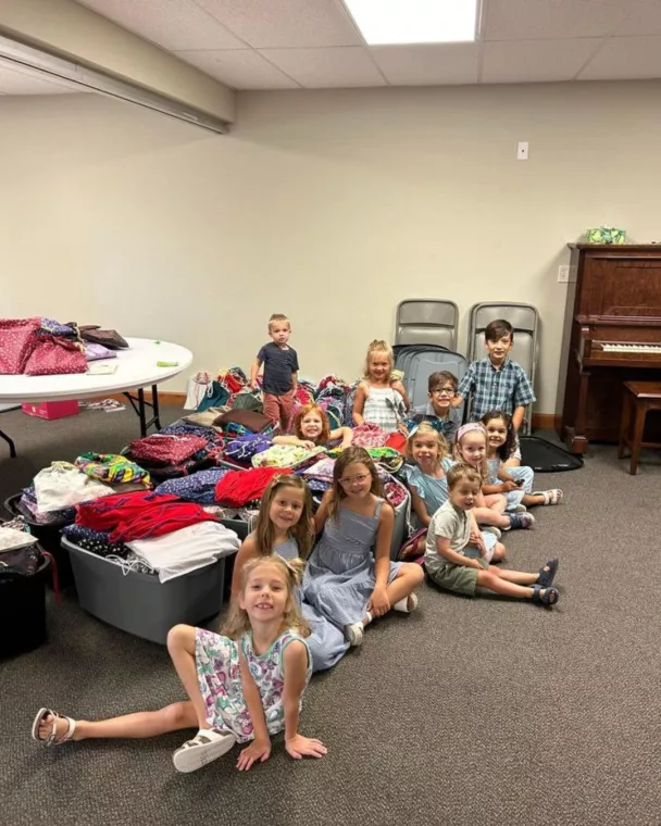 Members from a church pack school kits for MCC's School Kit Challenge.