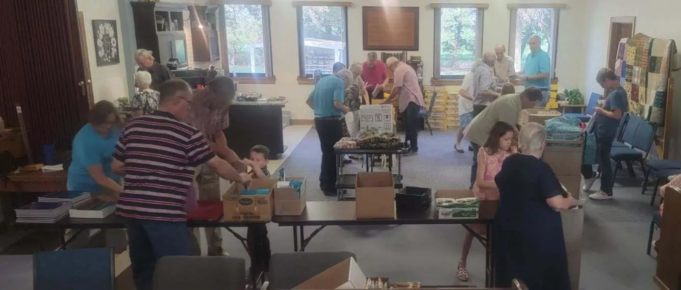 Members from a church pack school kits for MCC's School Kit Challenge.