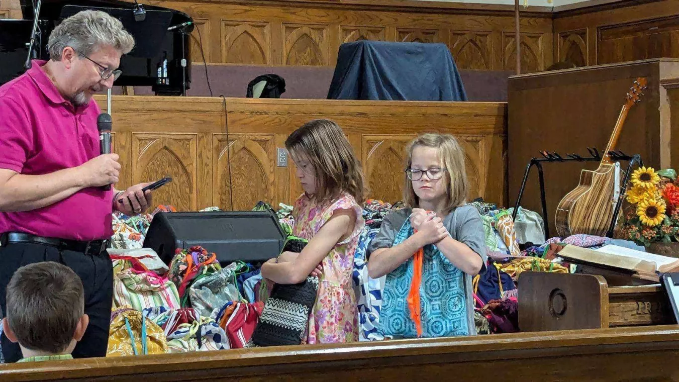 Members from a church pack school kits for MCC's School Kit Challenge.