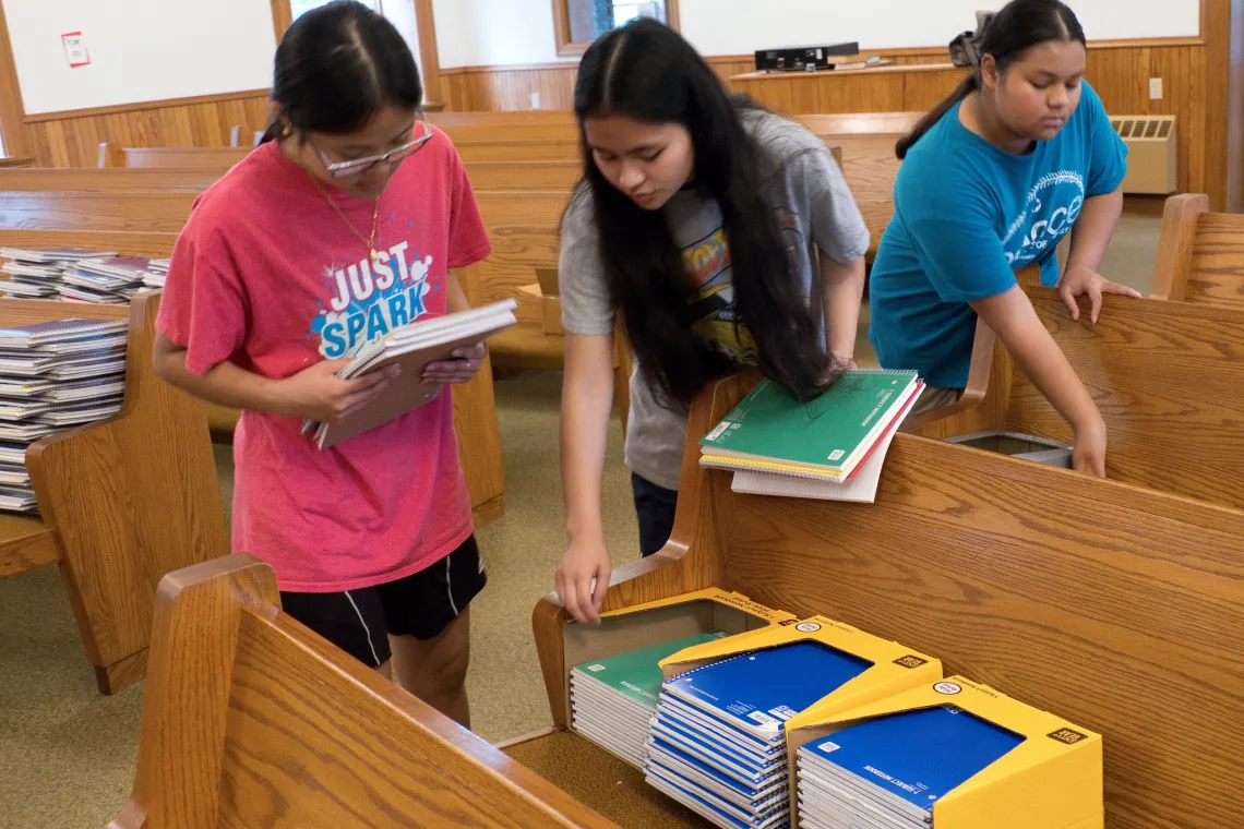 Members from a church pack school kits for MCC's School Kit Challenge.