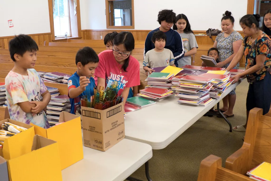 Members from a church pack school kits for MCC's School Kit Challenge.