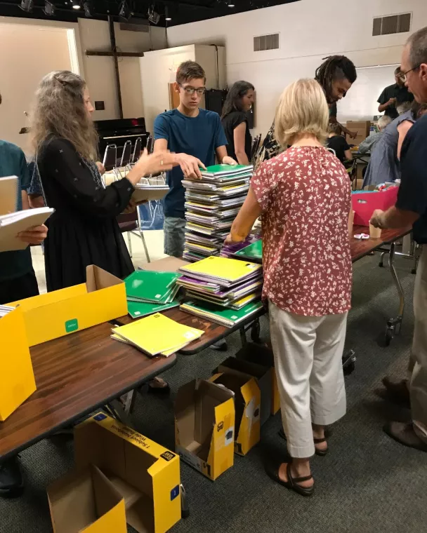 Members from a church pack school kits for MCC's School Kit Challenge.
