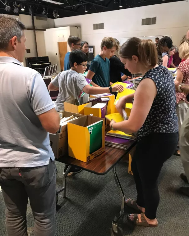 Members from a church pack school kits for MCC's School Kit Challenge.