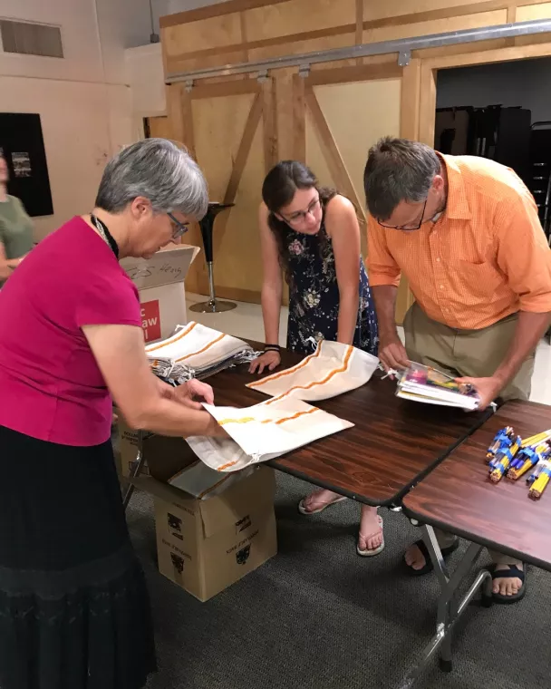 Members from a church pack school kits for MCC's School Kit Challenge.