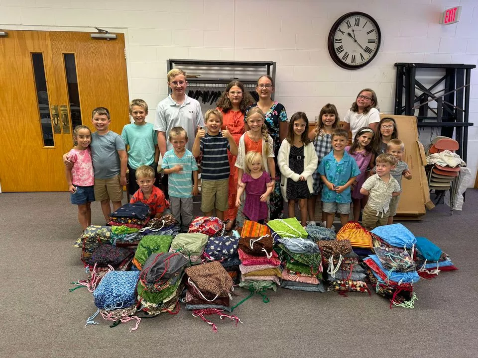 Members from a church pack school kits for MCC's School Kit Challenge.