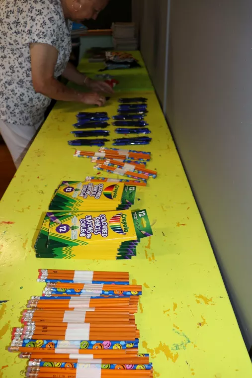Members from a church pack school kits for MCC's School Kit Challenge.