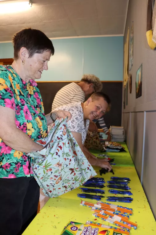 Members from a church pack school kits for MCC's School Kit Challenge.