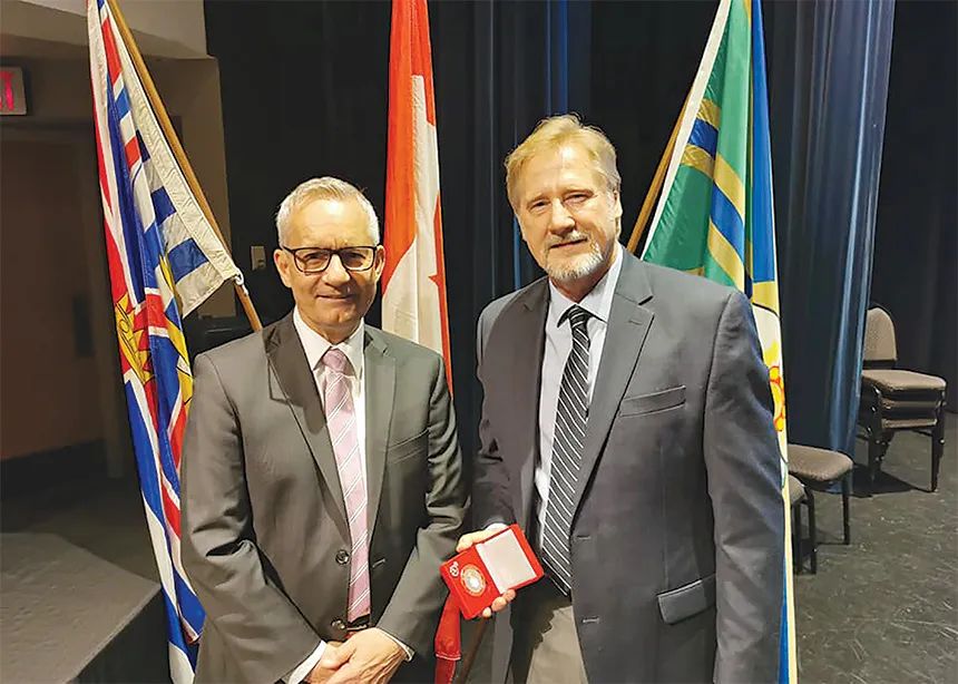 Wayne Bremner pictured shaking hands with former MP Ed Fast
