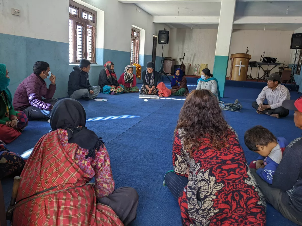 Members of the Ebi village water, sanitation and hygiene (WASH) committee gathered in a local church which doubles as a community centre, to provide feedback to MCC and Shanti Nepal staff about the project.