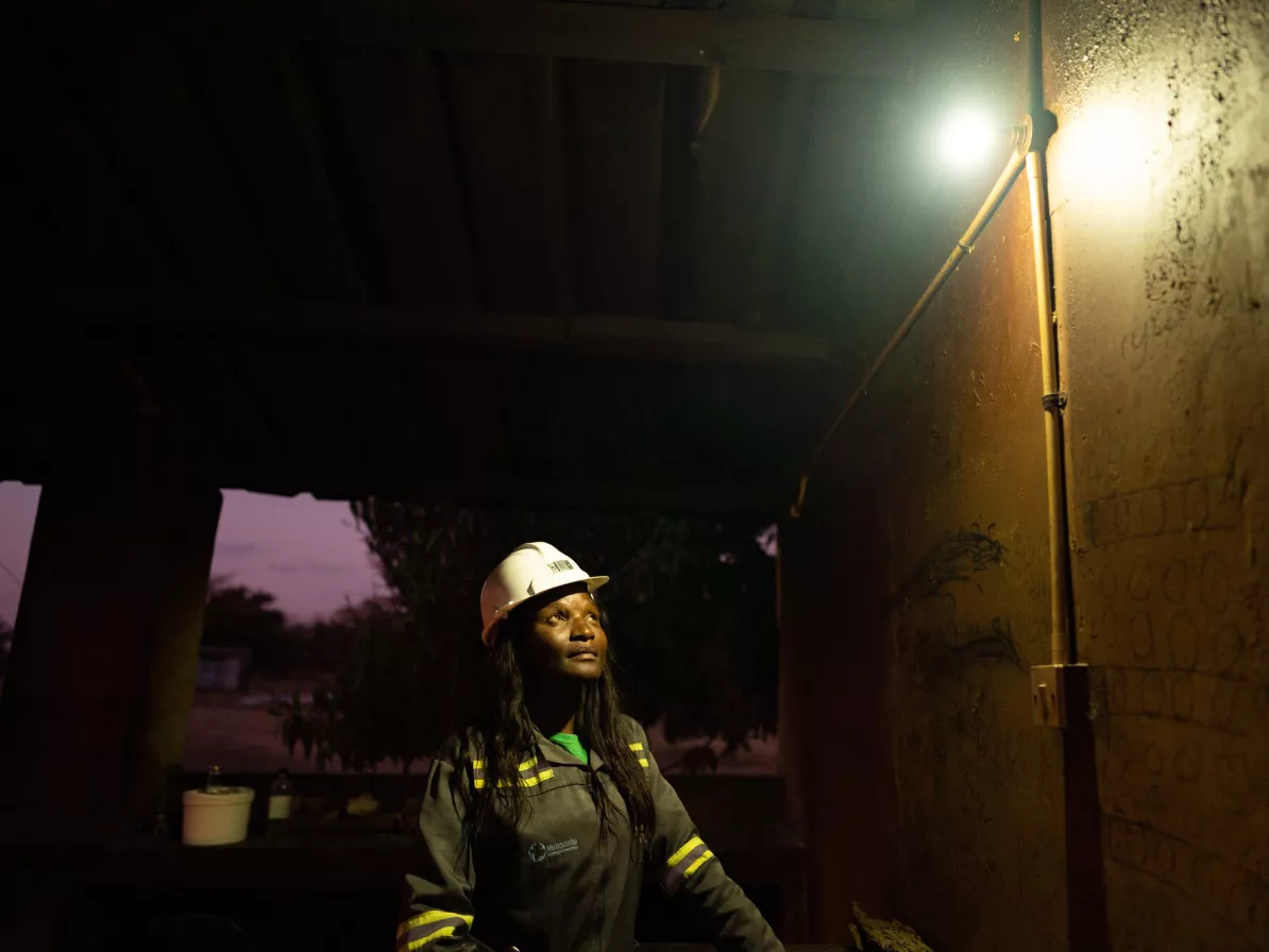 A woman looking at a light