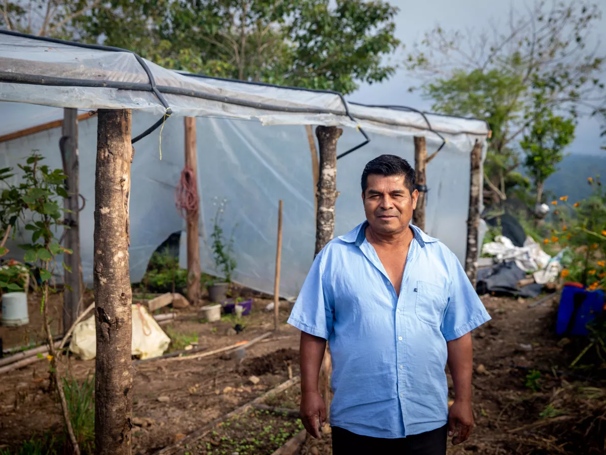 Fausto Rodríguez Gómez in front of his recently constructed greenhouse at his farm in Llano Bajo, Chiapas. The greenhouse will help protect delicate crops from low temperatures in the winter months.