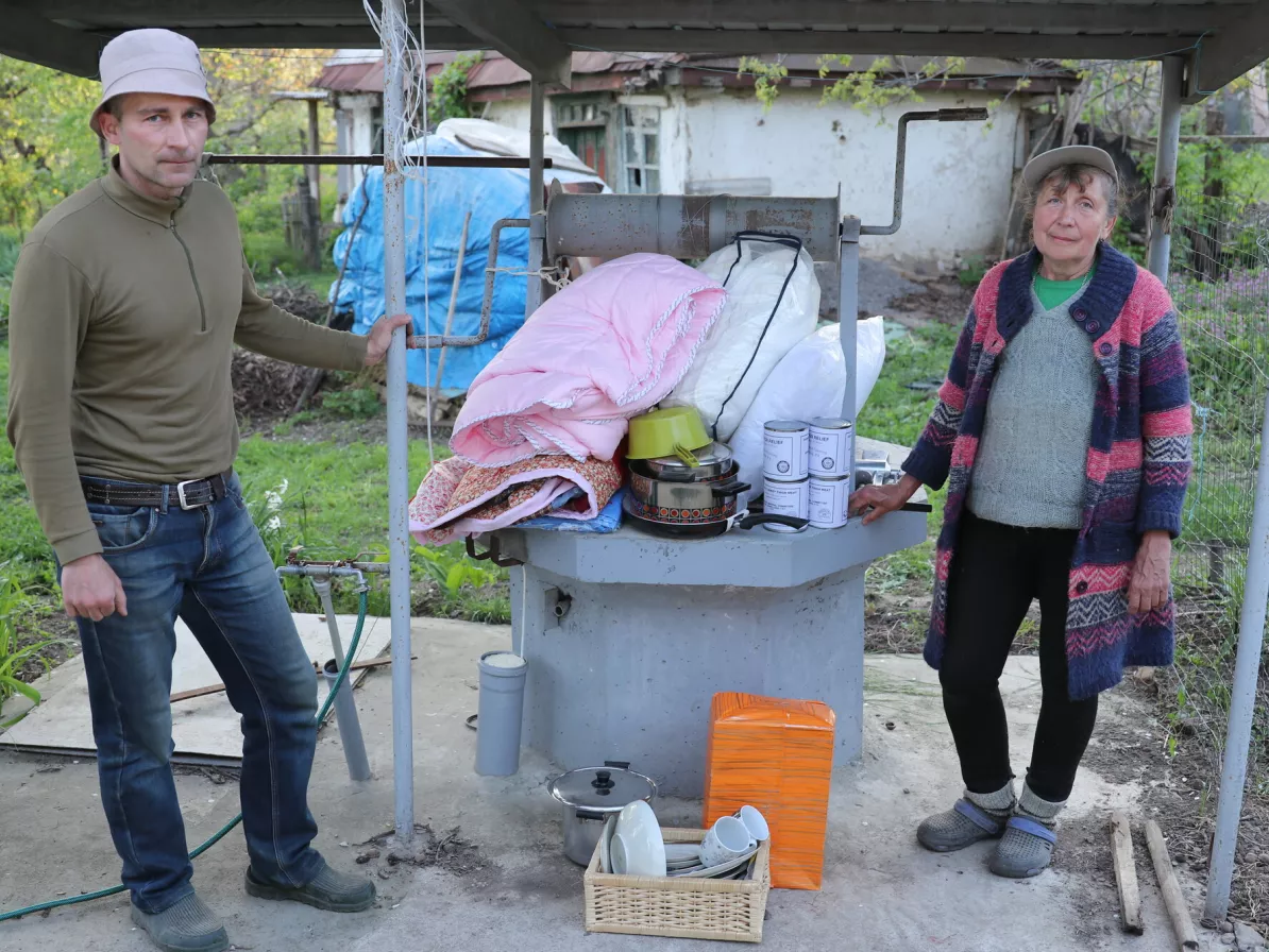 A couple in a makeshift kitchen in Ukraine